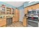 Updated kitchen with wine cooler, stainless appliances, granite countertops, and glass-front cabinets at 6546 Fairway Gardens Dr # 6546, Bradenton, FL 34203