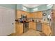 Updated kitchen featuring stainless steel appliances, granite countertops, and light wood cabinetry at 6546 Fairway Gardens Dr # 6546, Bradenton, FL 34203