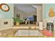 A sunlit kitchen shows a granite countertop, stainless faucet, and view of the living area at 6546 Fairway Gardens Dr # 6546, Bradenton, FL 34203