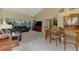 Inviting living room boasts vaulted ceilings, tile floors, and a view of the golf course at 6546 Fairway Gardens Dr # 6546, Bradenton, FL 34203