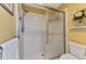 Shower room with white tile and sliding glass door, creating a clean and functional space at 6546 Fairway Gardens Dr # 6546, Bradenton, FL 34203