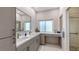 Modern bathroom with double sinks, a vanity area, and a walk-in shower at 6721 Oak Manor Dr, Lakewood Ranch, FL 34202