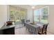 Cozy dining area with sliding glass doors leading to the screened lanai and a backyard at 6721 Oak Manor Dr, Lakewood Ranch, FL 34202