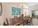 Bright dining room with chandelier, art, and a view of the home's interior, perfect for dinner at 6721 Oak Manor Dr, Lakewood Ranch, FL 34202
