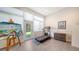Bright and airy exercise room with a treadmill, art, and access to the outdoors at 6721 Oak Manor Dr, Lakewood Ranch, FL 34202