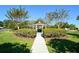 Gazebo surrounded by mature trees and meticulously manicured landscaping provides a relaxing space at 6721 Oak Manor Dr, Lakewood Ranch, FL 34202