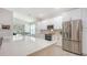 Modern kitchen with white cabinets, stainless steel appliances, and quartz countertops at 6721 Oak Manor Dr, Lakewood Ranch, FL 34202