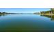 Expansive lake view on a sunny day, showcasing the calm waters and distant shoreline at 6721 Oak Manor Dr, Lakewood Ranch, FL 34202