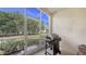Screened lanai features a grill, plenty of light, and views of the beautiful landscaping at 6721 Oak Manor Dr, Lakewood Ranch, FL 34202