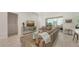 Open-concept living room with tile floors, natural light, and seamless connection to the kitchen and dining area at 6721 Oak Manor Dr, Lakewood Ranch, FL 34202