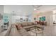 Open-concept living space featuring a comfortable sectional, dining area, and modern kitchen at 6721 Oak Manor Dr, Lakewood Ranch, FL 34202