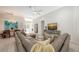 Open-concept living space featuring a comfortable sectional, dining area, and modern kitchen at 6721 Oak Manor Dr, Lakewood Ranch, FL 34202