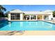 Community pool with clear water, lounge chairs, and tiled pool deck at 6721 Oak Manor Dr, Lakewood Ranch, FL 34202