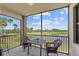 Relax on this screened-in lanai offering lovely views of the lake, golf course and tropical landscaping at 7005 River Hammock Dr # 203, Bradenton, FL 34212