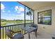 Relax on this screened-in lanai offering serene views of the lake, golf course and the palm trees at 7005 River Hammock Dr # 203, Bradenton, FL 34212