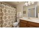 Bathroom featuring a shower curtain, vanity, and framed mirror at 7005 River Hammock Dr # 203, Bradenton, FL 34212