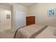 Bedroom showcasing closet space and dresser at 7005 River Hammock Dr # 203, Bradenton, FL 34212