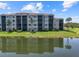 Exterior of the building reflecting in a pond at 7005 River Hammock Dr # 203, Bradenton, FL 34212