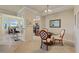 Open concept kitchen and dining area with granite counters and modern appliances at 7005 River Hammock Dr # 203, Bradenton, FL 34212
