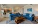 Spacious living room with bar stool seating and access to the dining area and open kitchen at 7005 River Hammock Dr # 203, Bradenton, FL 34212