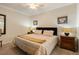 Comfortable bedroom featuring a ceiling fan, neutral tones, and tasteful decor at 7005 River Hammock Dr # 203, Bradenton, FL 34212