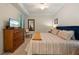 Serene bedroom with natural light, comfortable furniture, and calming decor at 7005 River Hammock Dr # 203, Bradenton, FL 34212