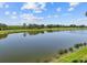 Pond view surrounded by lush landscaping at 7005 River Hammock Dr # 203, Bradenton, FL 34212