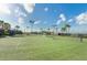 Well-maintained tennis courts with lush greenery and palm trees, perfect for active recreation at 7005 River Hammock Dr # 203, Bradenton, FL 34212