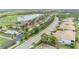 Community aerial featuring townhomes, a swimming pool, and scenic views of the golf course at 7235 River Hammock Dr # 204, Bradenton, FL 34212