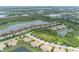 Beautiful aerial view of the community featuring residences nestled among lakes, golf courses, and natural preserves at 7235 River Hammock Dr # 204, Bradenton, FL 34212