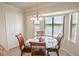 Bright dining area with a view of the pond is perfect for a quiet breakfast or Gathering dinner at 7235 River Hammock Dr # 204, Bradenton, FL 34212