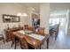 Open dining room with wood table, shell decor, and view into kitchen at 7235 River Hammock Dr # 204, Bradenton, FL 34212