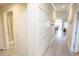 Hallway with wood floors with access to the bathroom and living space at 7235 River Hammock Dr # 204, Bradenton, FL 34212