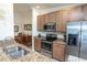 The Kitchen features granite counters, a stainless steel oven, and view to the dining room at 7235 River Hammock Dr # 204, Bradenton, FL 34212