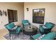 View of screened in patio with comfortable seating and tasteful decor at 7235 River Hammock Dr # 204, Bradenton, FL 34212