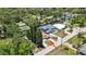 Waterfront home featuring backyard boat access, lush greenery, and street access at 7308 Maryland Ave, Hudson, FL 34667