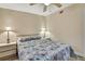 Cozy bedroom with a queen-size bed, two side tables, and lamps, ideal for restful nights at 7308 Maryland Ave, Hudson, FL 34667