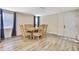 Bright dining room with modern flooring and window views at 7308 Maryland Ave, Hudson, FL 34667