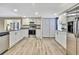 Modern kitchen featuring stainless steel appliances, granite countertops, and ample cabinet space at 7308 Maryland Ave, Hudson, FL 34667