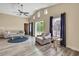 Bright living room with vaulted ceilings, slider, and ample seating area at 7308 Maryland Ave, Hudson, FL 34667