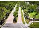 Aerial view of the Woodlands entrance, featuring well-kept streets and greenery, showcasing community at 766 Shadow Bay Way, Osprey, FL 34229