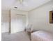 Cozy bedroom featuring a closet and a chair at 766 Shadow Bay Way, Osprey, FL 34229