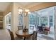 Dining area with backyard views and easy access to the patio at 766 Shadow Bay Way, Osprey, FL 34229