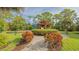 Charming gazebo with manicured landscaping, offering a serene spot for relaxation and enjoyment at 766 Shadow Bay Way, Osprey, FL 34229
