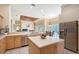 Well-appointed kitchen with a center island, stainless steel appliances, and seamless access to dining spaces at 766 Shadow Bay Way, Osprey, FL 34229