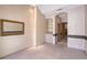 Bright room with custom wallpaper and a glimpse into the kitchen at 766 Shadow Bay Way, Osprey, FL 34229