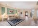 Bright living room with tile flooring, stylish furniture, and an open layout flowing into other living spaces at 766 Shadow Bay Way, Osprey, FL 34229