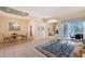 Spacious living room with tile flooring, elegant furnishings, and an open layout perfect for entertaining at 766 Shadow Bay Way, Osprey, FL 34229