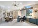 Bright office space with custom built-ins, a large window, and a ceiling fan at 766 Shadow Bay Way, Osprey, FL 34229