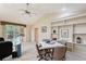 Well-appointed office area with built-in shelving, and access to a patio at 766 Shadow Bay Way, Osprey, FL 34229